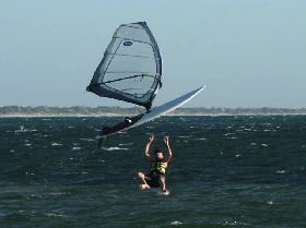 Windsurfing - Mart checks his board for weed...